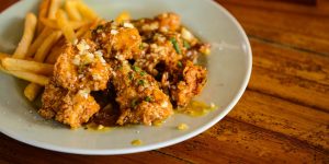 Crispy chicken with passion fruit sauce